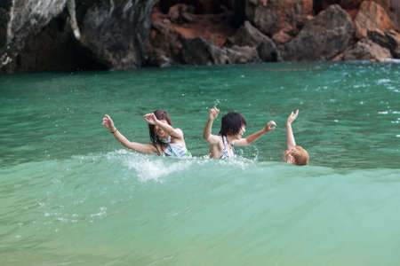 Girls swimming in the seaの写真素材