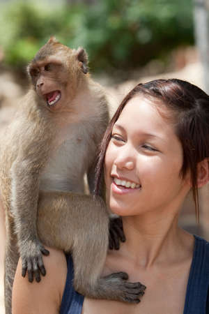 Girls with monkeyの写真素材