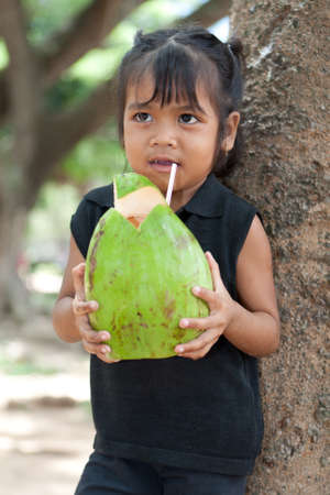 asian girl with coconutの写真素材