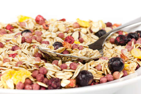 Healthy Breakfast, Granola with bowl with spoon on white backgroundの写真素材