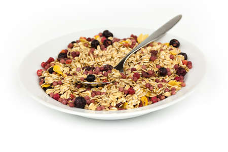 Healthy Breakfast, Granola with bowl with spoon on white backgroundの写真素材