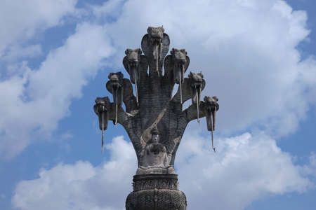 Buddhist Figurine, spirituality sculpture from stone with seven snakesの写真素材