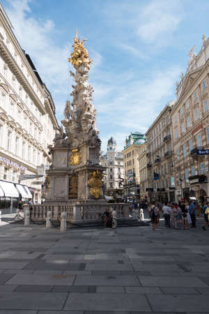 Vienna, Austria - July 31, 2017: The Street Am Graben in Central Vienna with the PestsÃ¤ule. Tourists are walking around and enjoy the points of interest on a sunny dayのeditorial素材