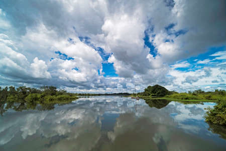 Lake With Reflection Of Cumulus Clouds