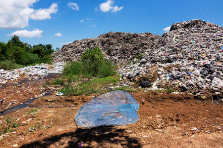junkyard in the nature with blue sky and clouds