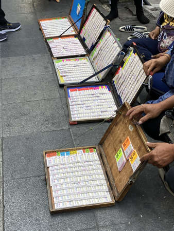 Bangkok, Thailand - December 11, 2019:  Lottery is very popular in Thailand and the relationship is every two weeks. Street vendors offer lottery ticketsのeditorial素材