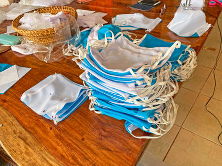 Ban Don Bak, Thailand - March 14, 2020: village people produce by hand their own face mask to protecting themself of virus infectionのeditorial素材