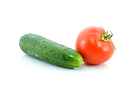 Red tomato and green cucumber isolated on the white backgroundの写真素材