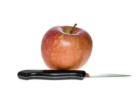Red apple and small steel knife isolated on the white backgroundの写真素材