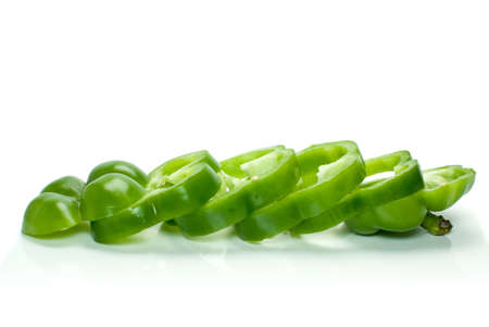 Sliced green sweet pepper isolated on the white backgroundの写真素材