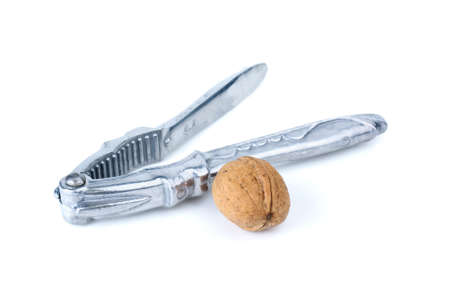 Silver nutcracker and walnut isolated on the white backgroundの写真素材