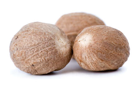 Nutmegs macro isolated on the white backgroundの写真素材