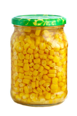 Glass jar with marinated corn grains isolated on the white backgroundの写真素材