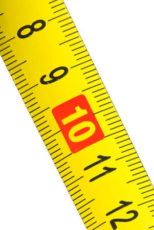 Close-up shot of yellow metal measurement tape. Isolated on the white background. Focused on '10'...