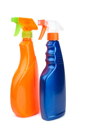 Orange and blue sprayer bottles isolated on the white background