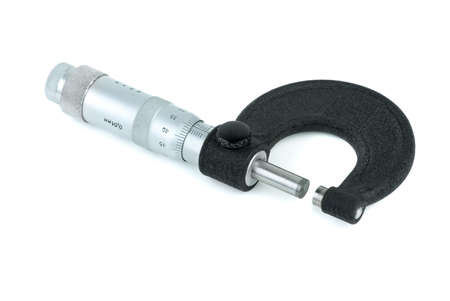 Old micrometer caliper isolated on the white background