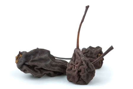 Three dried smoked pears isolated on the white backgroundの写真素材