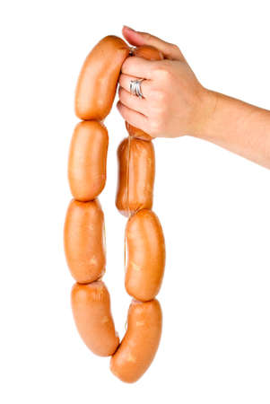Hand holding sausages chain isolated on the white backgroundの写真素材
