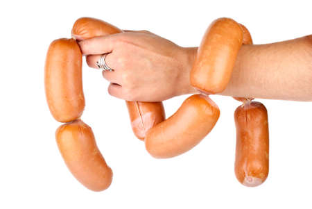 Hand holding sausages chain isolated on the white backgroundの写真素材