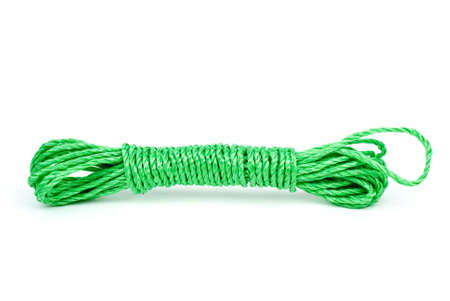 Green plastic rope reeling isolated on the white backgroundの写真素材
