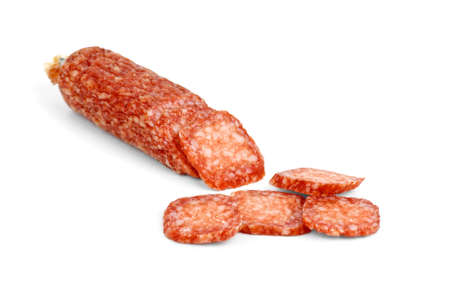 Half of salami sausage and some slices near isolated on the white backgroundの写真素材