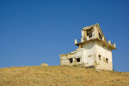 Ruined lighthouse building. Meganom cape, Crimea, Ukraineの写真素材