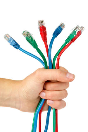 Bunch of different colored patch-cords gripped in fist  isolated on the white background