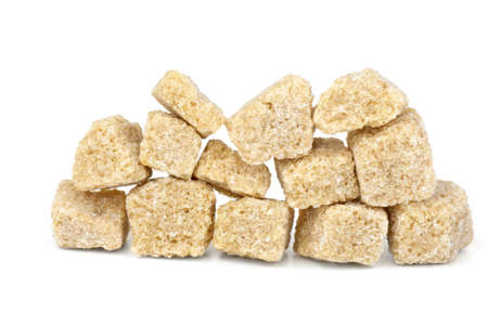 Few pieces of brown sugar isolated on the white backgroundの写真素材