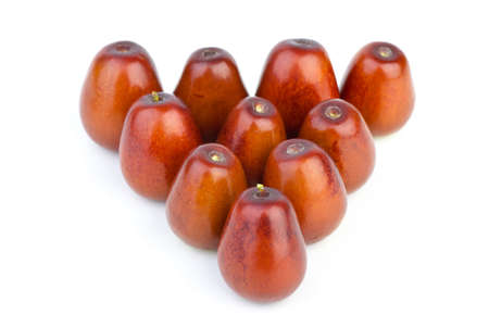 Ten ripe jujube berries  isolated on the white backgroundの写真素材