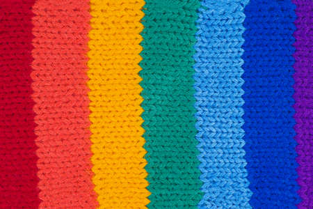 Rainbow knitted fabric. White backgroundの写真素材