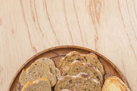 Sliced bread rustic bread on a wooden background with copy space,top view, Bakery poster concept.