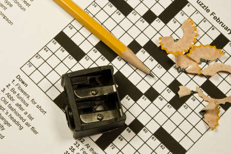 crossword puzzle with pencil, sharpener,and shavingsの写真素材