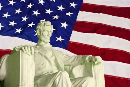 statue of abraham lincoln against the American flagの写真素材