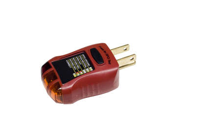 electrical outlet tester on white の写真素材