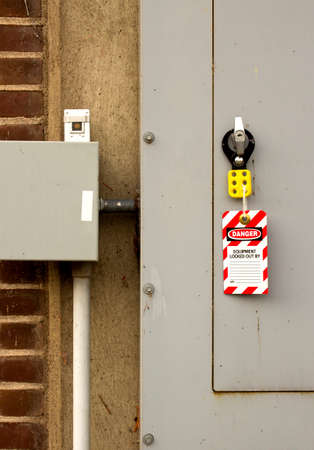 lockout device and tag attached to a large electrical panel