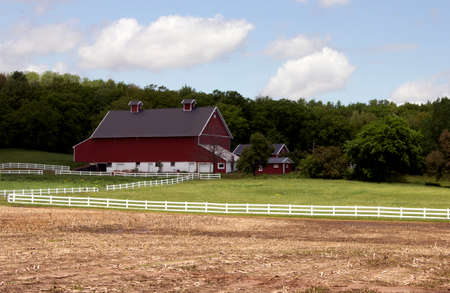 RIVER FALLS,WISCONSIN-JUNE 02,2014: A vintage red barn and outbuildings near River Falls,Wisconsin on June 02,2014.のeditorial素材