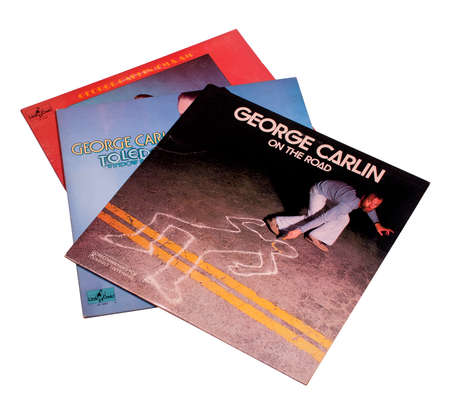 RIVER FALLS,WISCONSIN-JANUARY 20,2015: Three vintage George Carlin albums. George Carlin is regarded as one of the most influential comedians of all time,.のeditorial素材