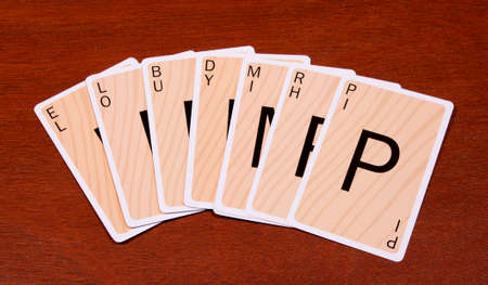 RIVER FALLS,WISCONSIN-MARCH 22,2015: Several Boggles cards on a wood background. These cards are based on the original Boggle game.のeditorial素材
