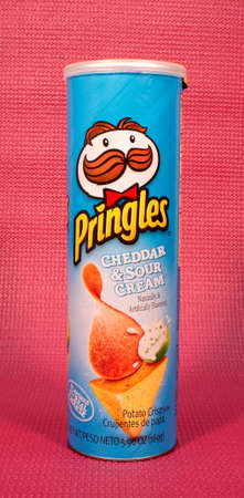 RIVER FALLS,WISCONSIN-MAY19,2015: A can of Pringles brand Sour Cream and Cheddar chips. Pringles chips are distributed by the Kellogg Company.のeditorial素材