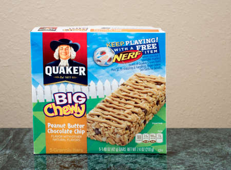 RIVER FALLS,WISCONSIN-JULY 24,2015: A box of Quaker brand Big and Chewy granola bars. Quaker Oats Company has been owned by PepsiCo since Two Thousand One.のeditorial素材