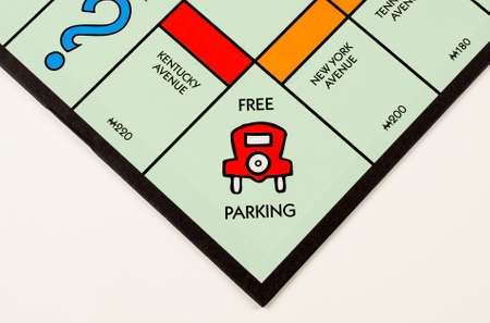 RIVER FALLS,WISCONSIN-NOVEMBER 16,2015: A Monopoly board featuring the Free Parking square. Monopoly...