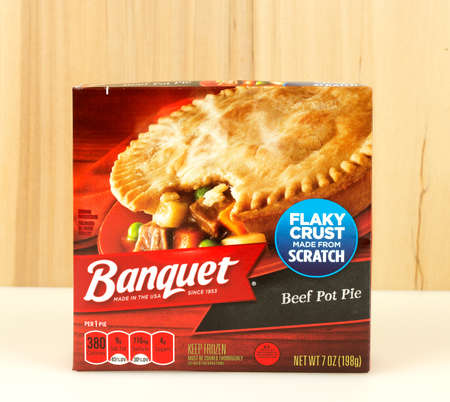 RIVER FALLS,WISCONSIN-DECEMBER 01,2016: A Banquet brand pot pie box against a wood backdrop.のeditorial素材
