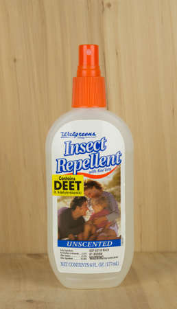 RIVER FALLS,WISCONSIN-APRIL 18,2017: A bottle of Walgreen's brand insect repellent with a wood background.のeditorial素材