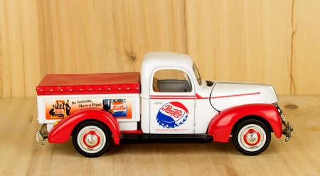 RIVER FALLS,WISCONSIN-APRIL 20,2017: A toy Pepsi truck against a wood background.のeditorial素材