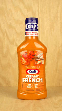 RIVER FALLS,WISCONSIN-JULY 14,2017: A bottle of Kraft brand creamy french dressing with a wood background.のeditorial素材