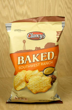 RIVER FALLS,WISCONSIN-AUGUST 12,2017ag of Clancy's brand southwest ranch flavored potato crisps with a wood background.のeditorial素材