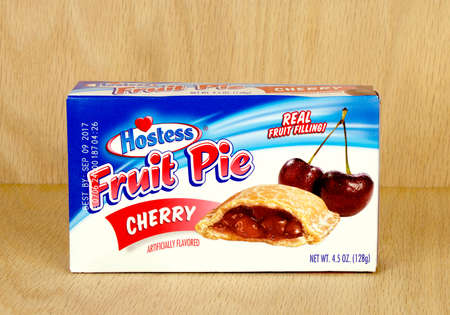 RIVER FALLS,WISCONSIN-AUGUST 21,2017: A Hostess brand cherry pie box with a wood background.のeditorial素材
