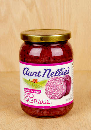 RIVER FALLS,WISCONSIN-AUGUST 25,2017: A jar of Aunt Nellie's brand red cabbage with a wood background.のeditorial素材
