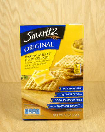 RIVER FALLS,WISCONSIN,AUGUST 26,2017: A box of Savoritz brand woven wheat snack crackers with a wood background.のeditorial素材
