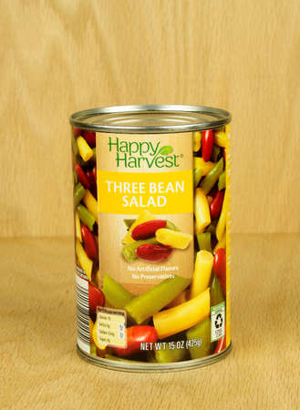 RIVER FALLS,WISCONSIN-AUGUST 28,2017: A can of Happy Harvest brand three bean salad with a wood background,のeditorial素材